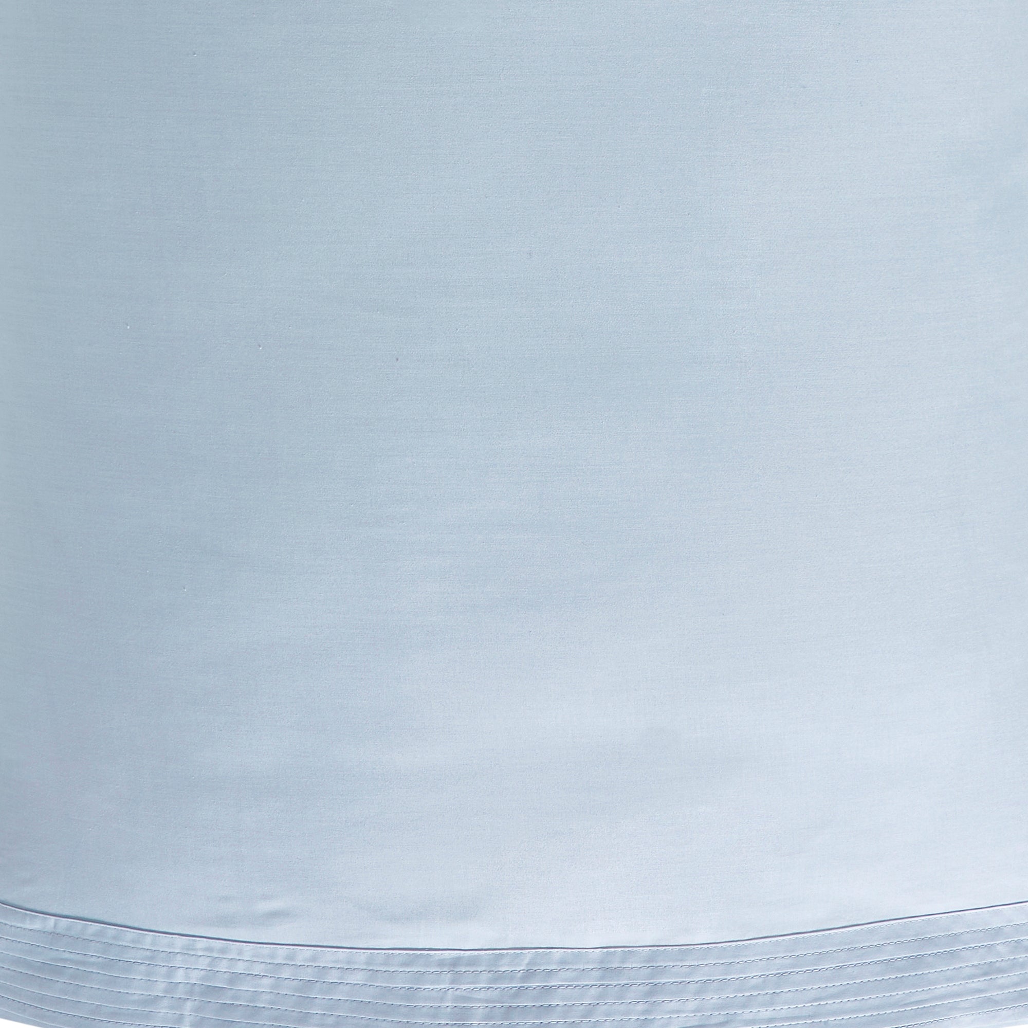 KSS-524-7880_6|Close-up view of soft, smooth light blue 100% cotton sateen sheets showcasing elegant pintuck hem detail for luxurious comfort.