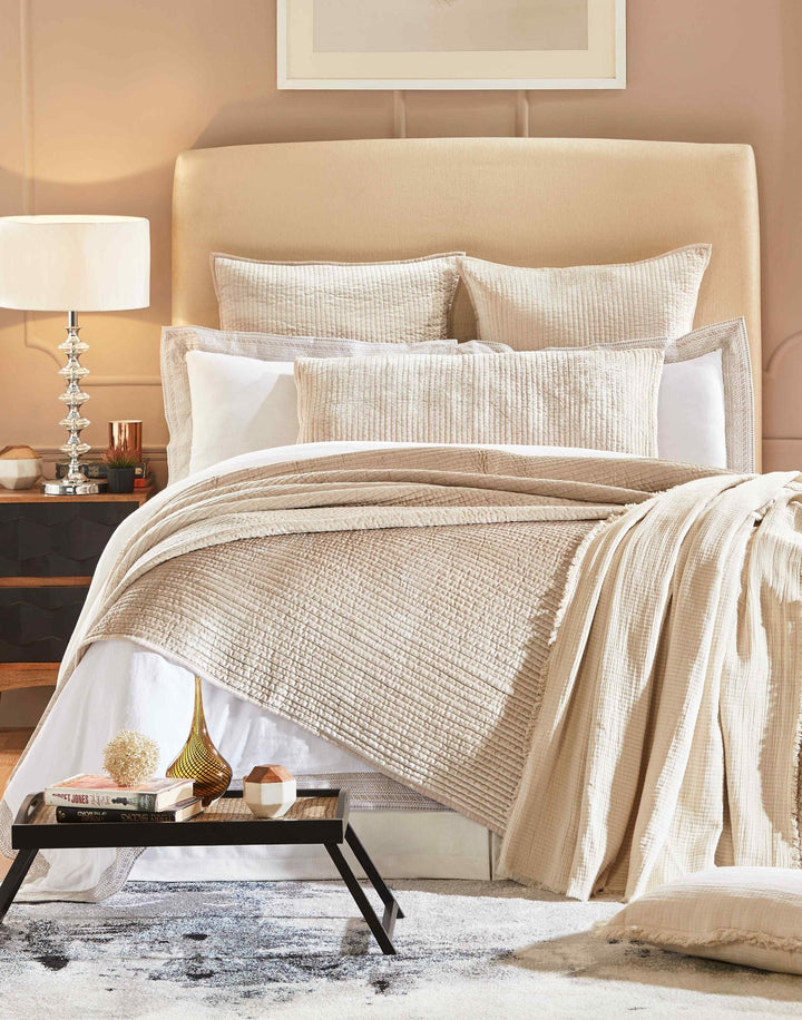 CL-154-11898_1|Soft beige textured coverlet elegantly drapes over a comfortable bed, creating a tranquil and inviting bedroom ambiance.