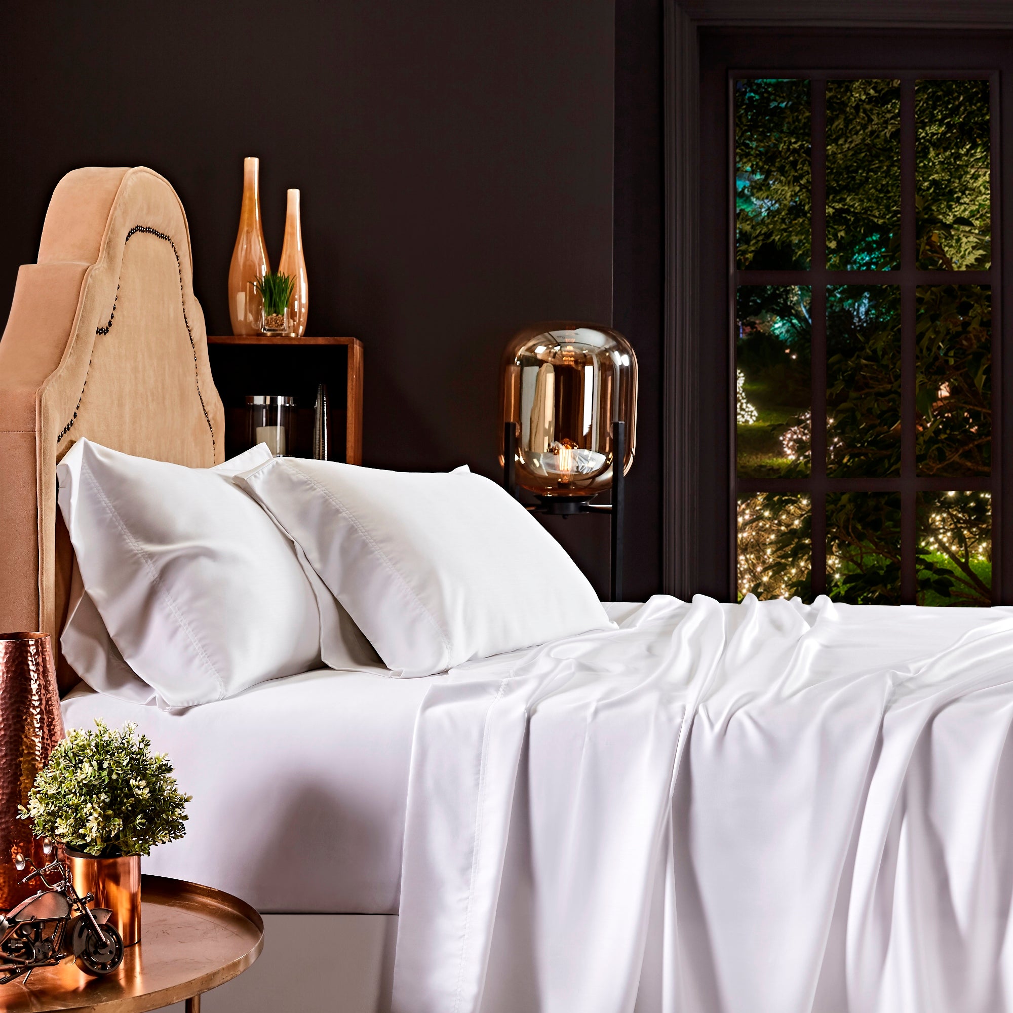 QFL-509-6080_2|Luxurious white 100% Lyocell sheets draped over a bed, with smooth, breathable fabric, perfect for a comfortable night's sleep.