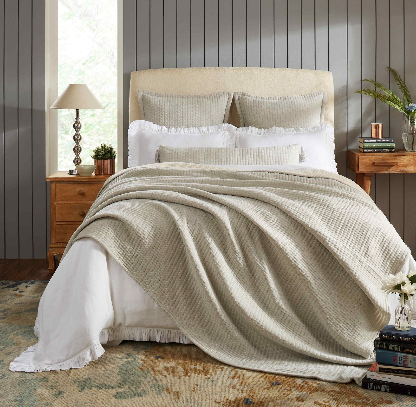 BT-107-9496_4|Cozy beige textured reversible quilt blanket elegantly draped over a bed with white sheets, perfect for inviting bedroom decor.