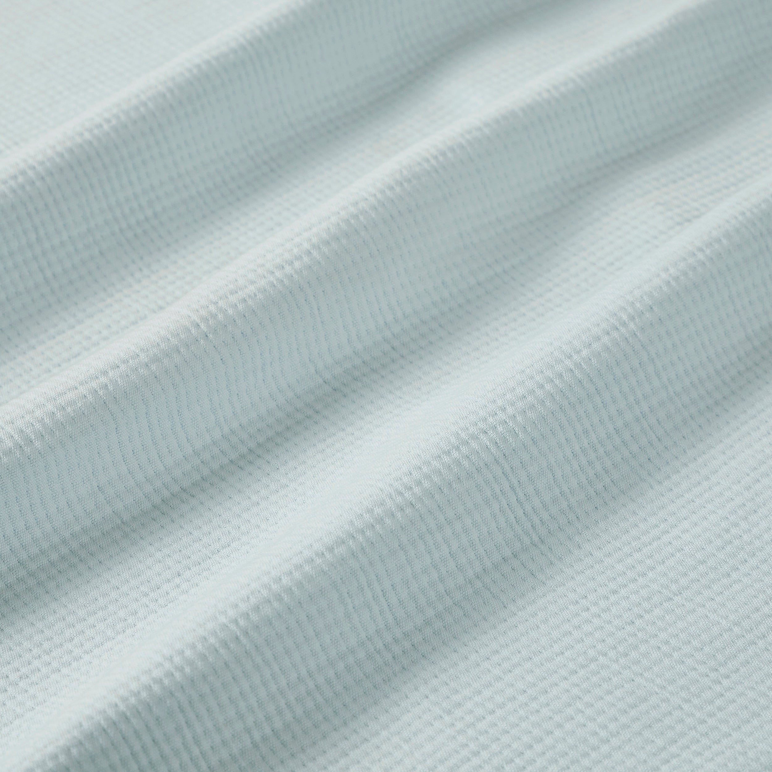 BL-859-9496_9|Draped and folded light blue waffle-weave blanket fabric, soft and inviting, perfect for stylish layering in bedroom decor.