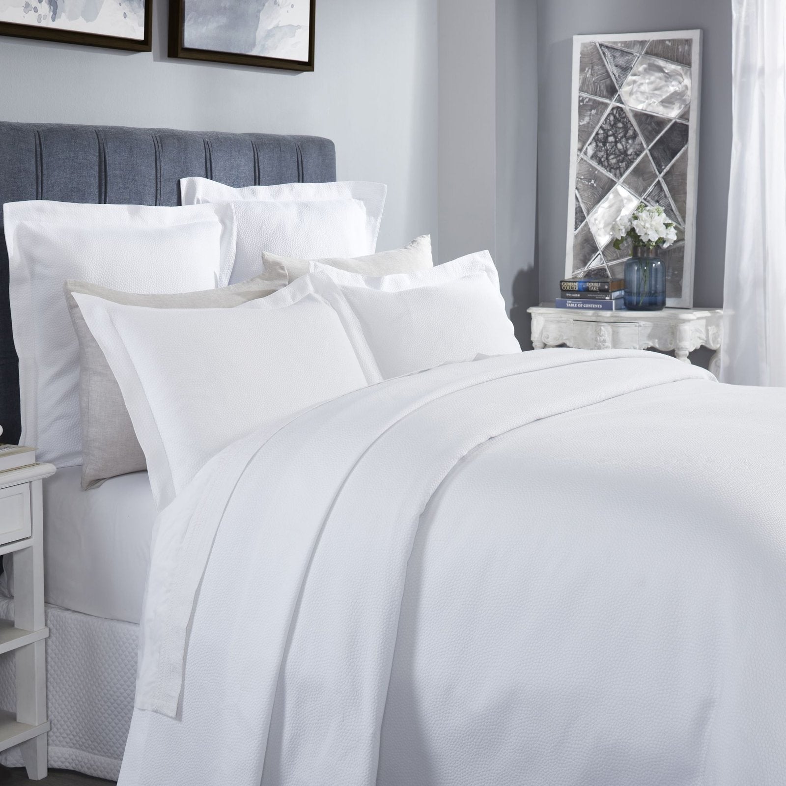 CL-258-11096_3|Crisp white coverlet featuring a delicate, subtle dimpled texture for a modern and clean bedroom design.
