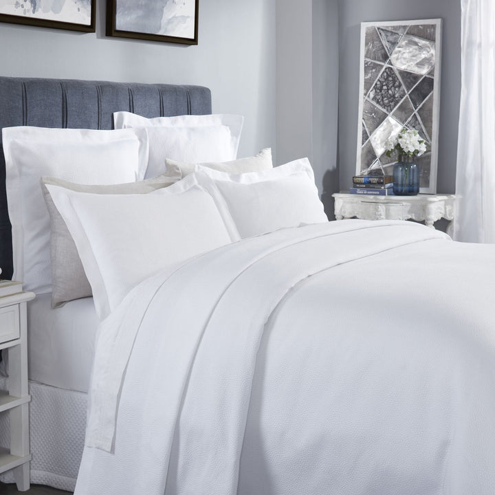 CL-258-11096_3|Crisp white coverlet featuring a delicate, subtle dimpled texture for a modern and clean bedroom design.