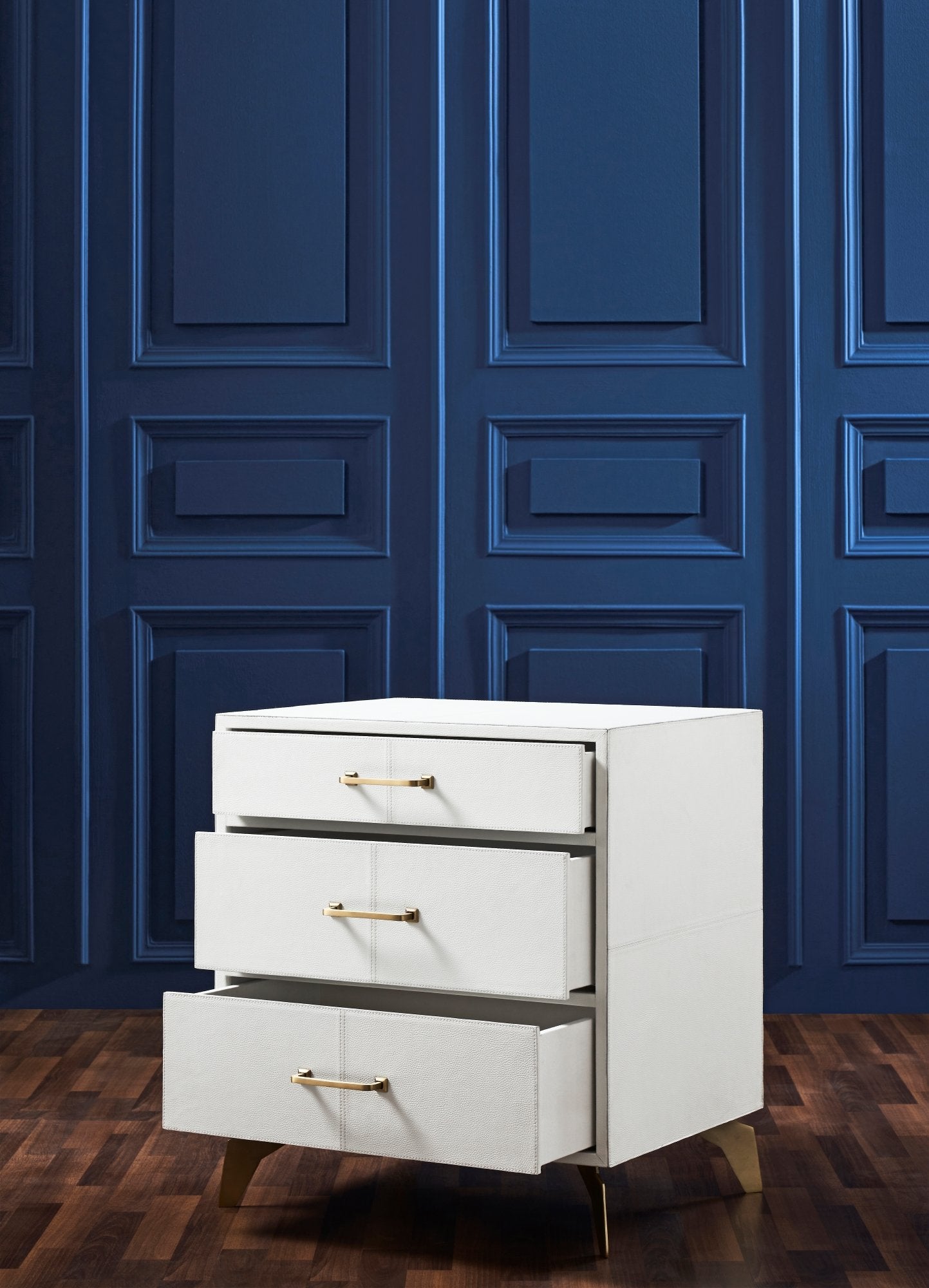FN-5201-262028_4|Modern white shagreen three-drawer nightstand with gold hardware, one drawer slightly open. Bedroom storage.