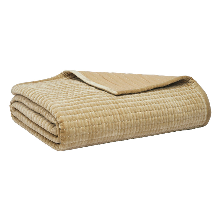 CL-267-11096_7|Neatly folded tan quilted velvet coverlet, showcasing its rich texture and warm color, perfect for cozy bedding.