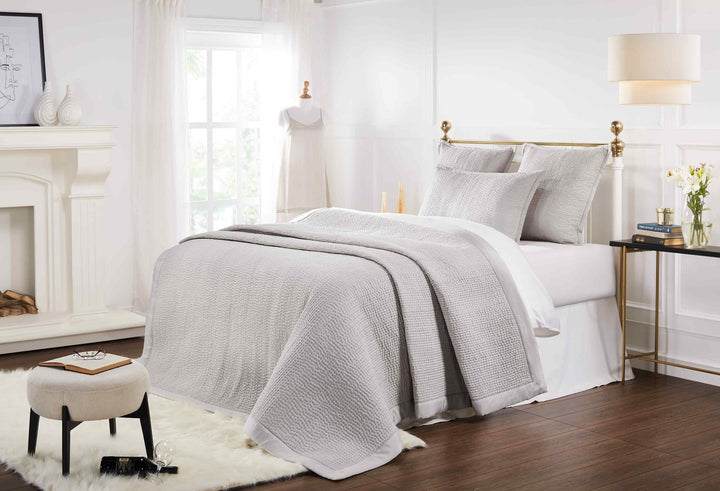 CL-166-11096_2|Light grey quilted coverlet featuring a small, irregular waffle-like quilting pattern and clean finish. Bed setting.