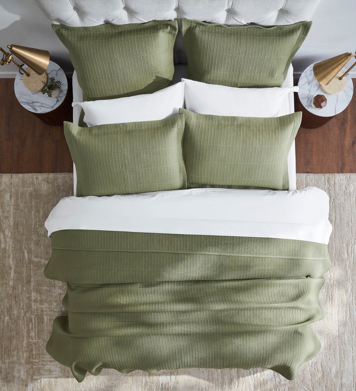 CL-270-9496_4|Aerial view of a bed with a sage green textured cotton blend coverlet and pillows, showcasing elegant bedding.