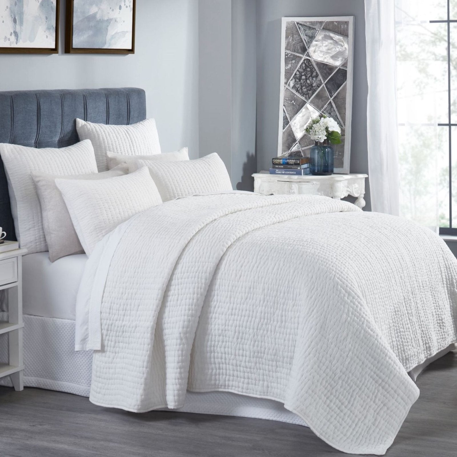 QT-359-9496-LOT1_2|Crisp white quilted duvet cover and shams adorning a stylish bedroom setting. Textured cotton quilt adds comfort and elegance.