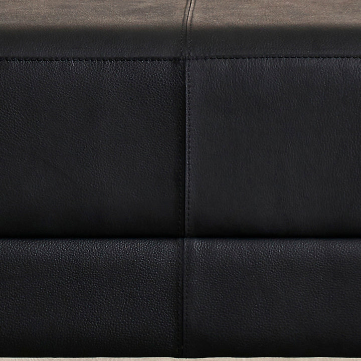 FN-5200-601618_6|Detail shot of the exquisite black leather upholstery on furniture, showcasing fine grain texture and precise stitching.