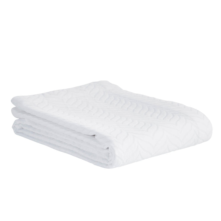 CL-194-9496_6|White quilted coverlet, folded, with subtle leaf pattern, plush textured bedding for modern bedroom decor, soft and elegant.