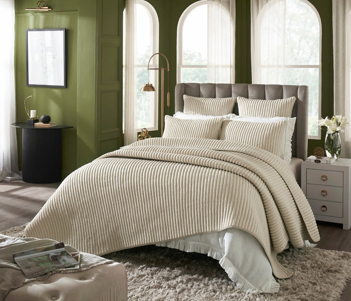 QT-368-11096_2|Elegant bedroom with beige ribbed quilted quilt, shams, and throw pillows, creating a cozy and inviting atmosphere.
