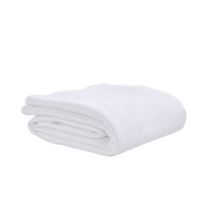 CL-170-9496_7|Crisp white folded coverlet, featuring a subtle chevron textured pattern. Ideal lightweight bedding for modern bedrooms.