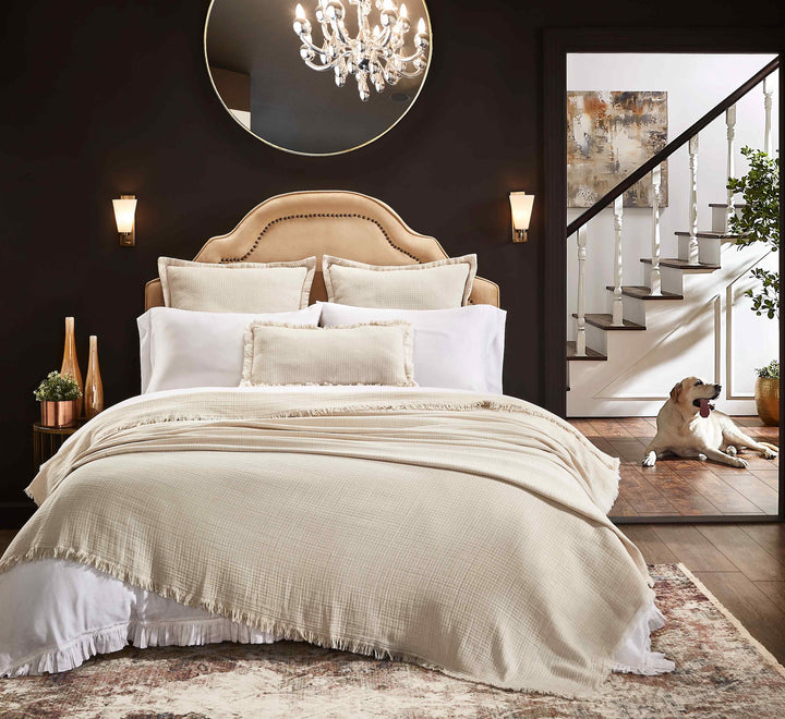 BT-114-9496_2|Luxurious beige textured blanket with a stylish fringe edge draped over a bed, adding warmth and elegance to modern bedroom decor.