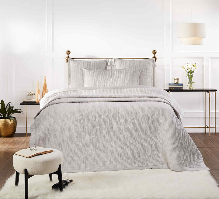 CL-166-9496_3|Light grey textured coverlet with matching shams on a luxurious bed, enhancing bedroom comfort and style.