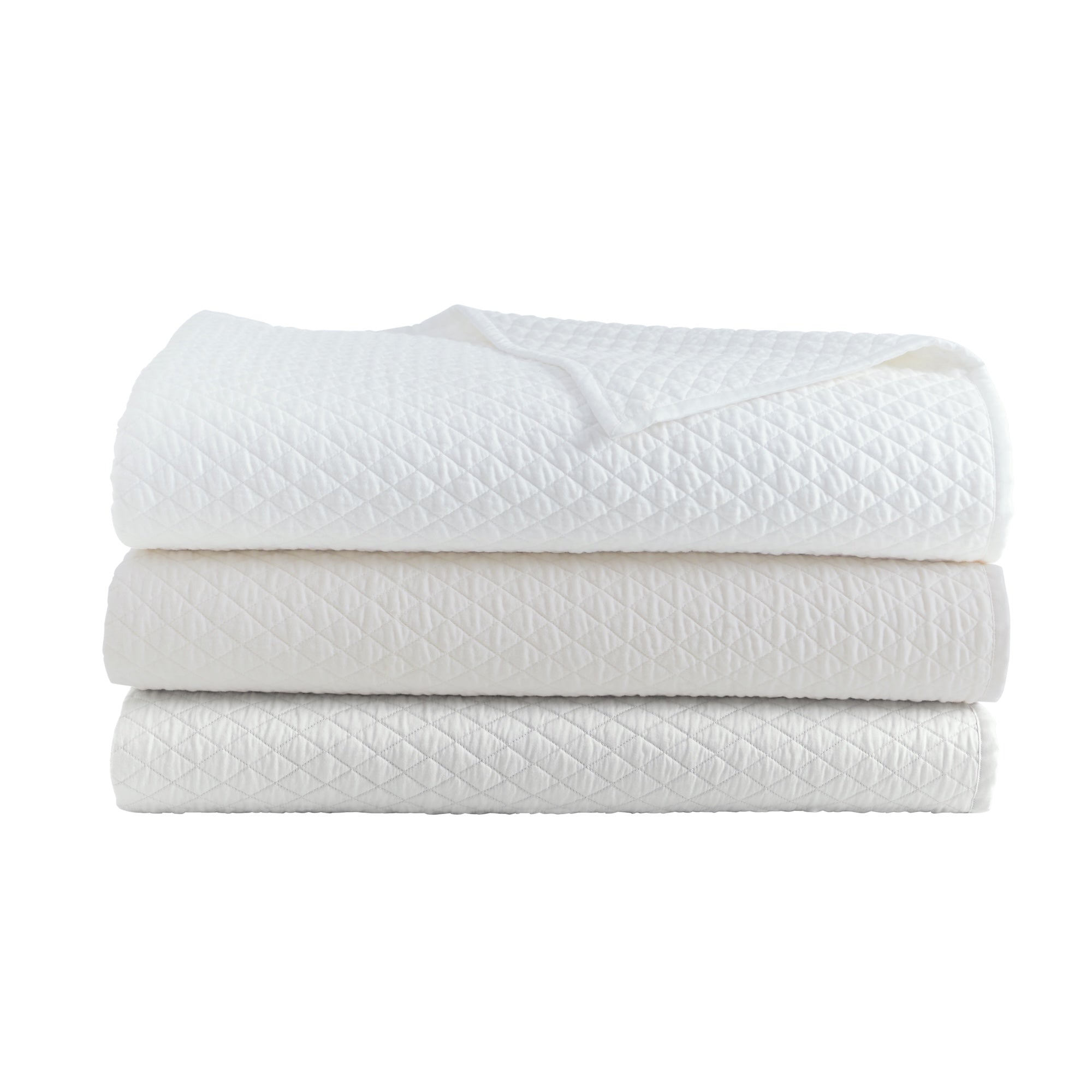 CL-266-11096_7|Stack of three diamond quilted coverlets: crisp white, soft ivory, and light gray. Luxurious bedding for a serene bedroom.