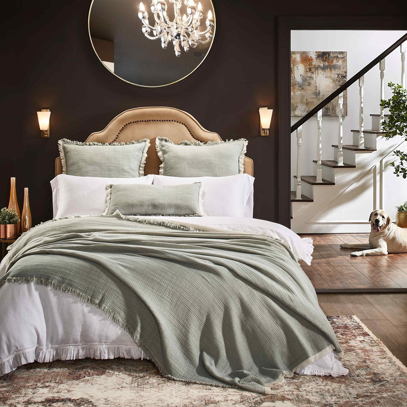 BT-109-11096_5|Stylish sage green crinkled blanket with frayed edges draped over a bed, creating a relaxed, bohemian bedroom aesthetic.