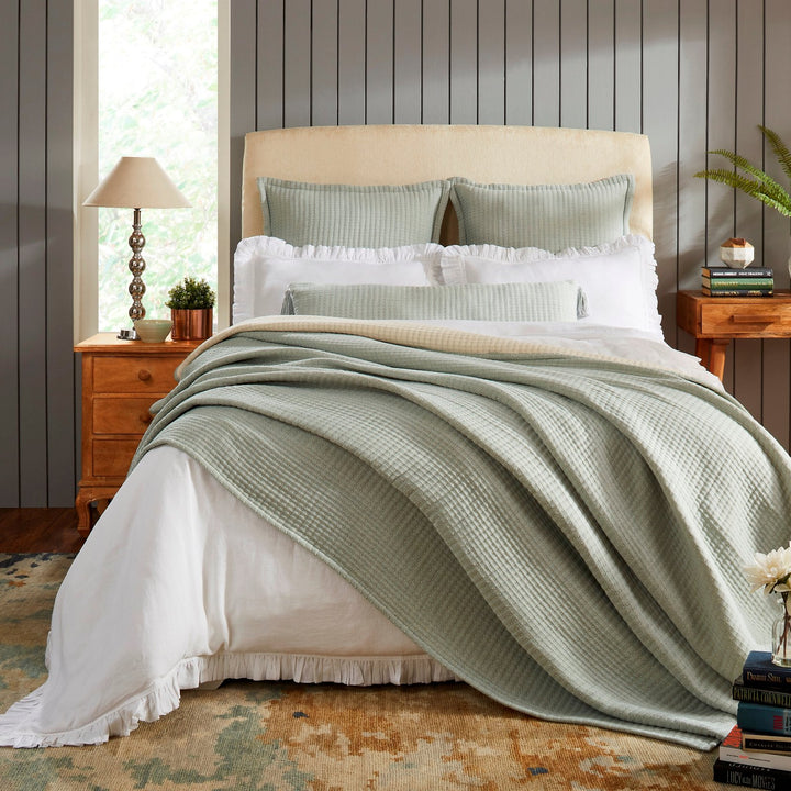 BT-106-9496_1|Serene sage green textured blanket draped over a cozy bed, enhancing bedroom comfort and adding a calming, natural touch.