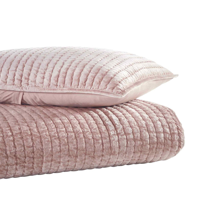 QT-354-9496_2|Stack of plush dusty pink velvet quilt and matching pillow sham. Channel-quilted texture, luxurious cozy bedding set.