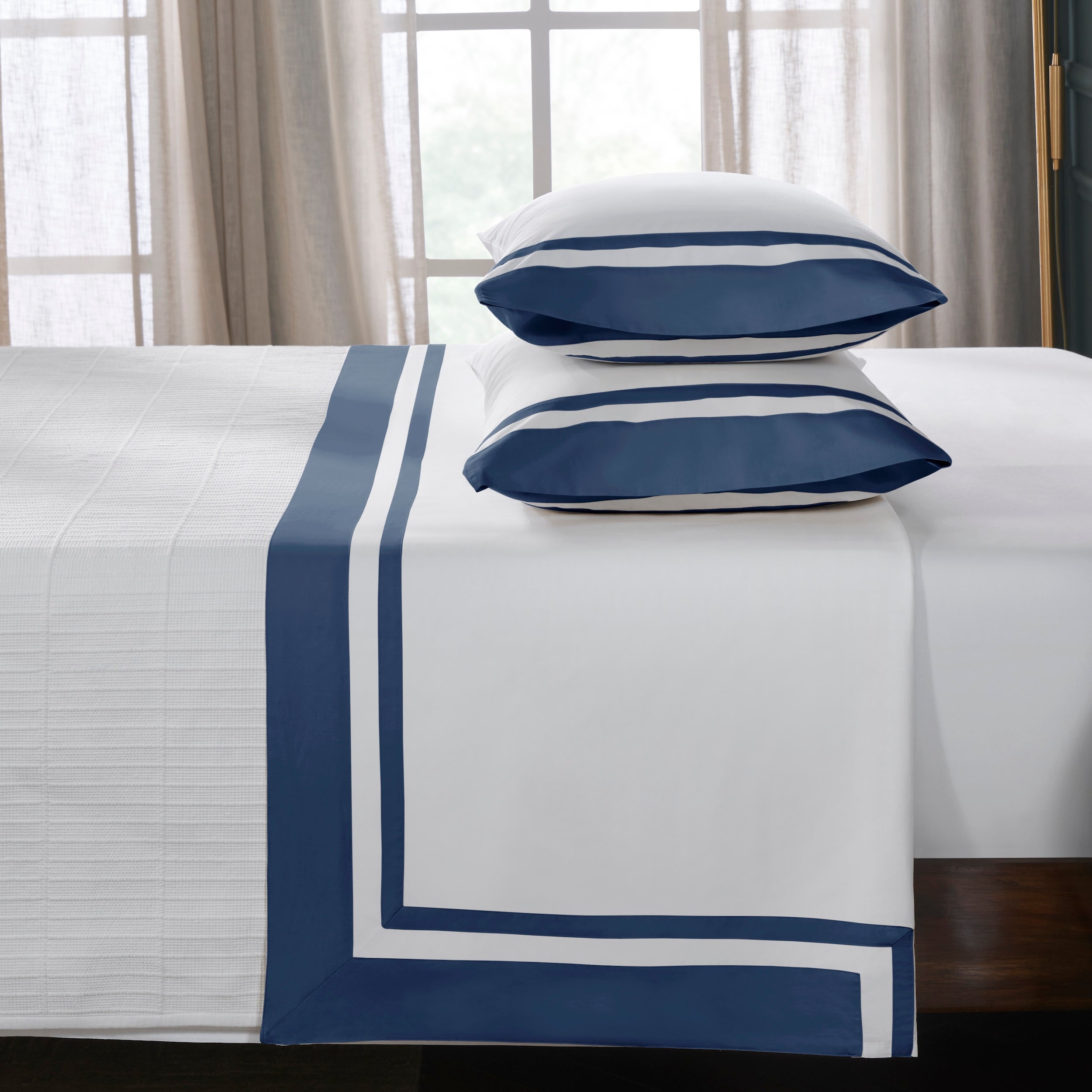 KFL-548-7880_3|Crisp white 100% cotton sheets with stylish navy blue striped border, offering comfort and elegance for any bedroom.