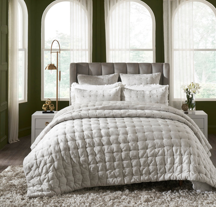 QT-306-11096_1|Luxurious light grey square-quilted bedspread on a bed, providing plush comfort and a sophisticated textured look.
