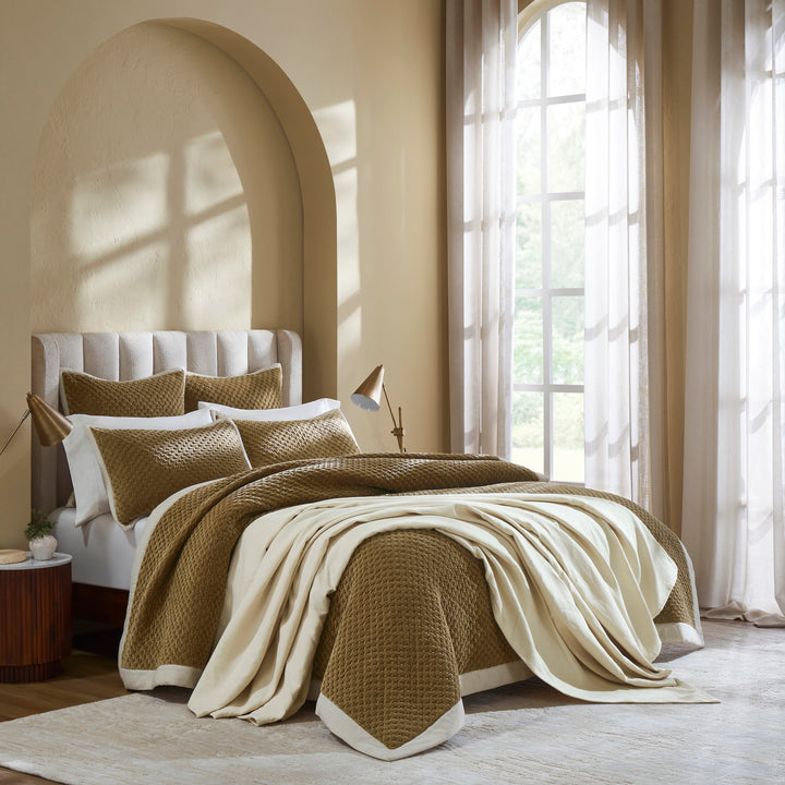 QT-378-9496_2|Elegant gold textured quilt with matching shams and a coordinating throw blanket on a queen bed. Luxurious bedroom decor.