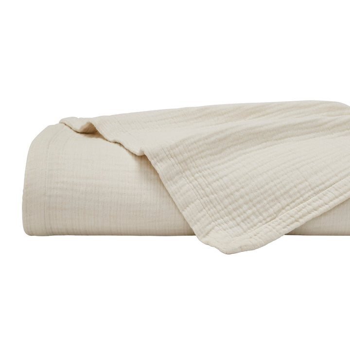 BL-862-11096_6|Neatly folded cream cotton blanket with a soft, textured finish, ideal for cozy bedroom decor or a lightweight, breathable throw.