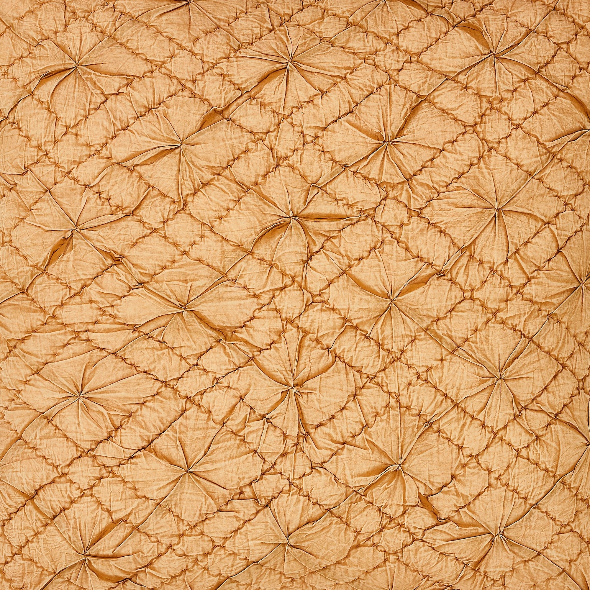 SWT-364-7.8_1|Rich golden-tan quilted fabric with unique raised puff diamond pattern, adding plush texture for luxurious home decor.