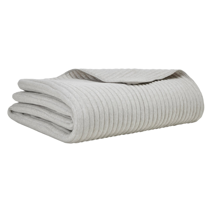 QT-375-9496_6|Neatly folded light grey ribbed quilt, offering a soft, textured comfort layer for contemporary bedroom decor.