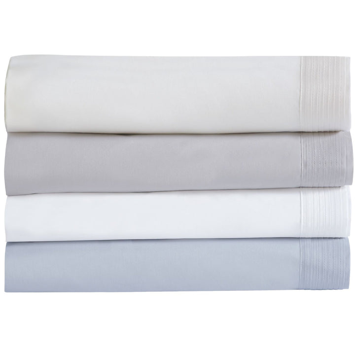 CSS-521-7284_5|Stack of four luxurious 100% cotton sheet sets in various neutral shades, all featuring elegant pintuck pleats.