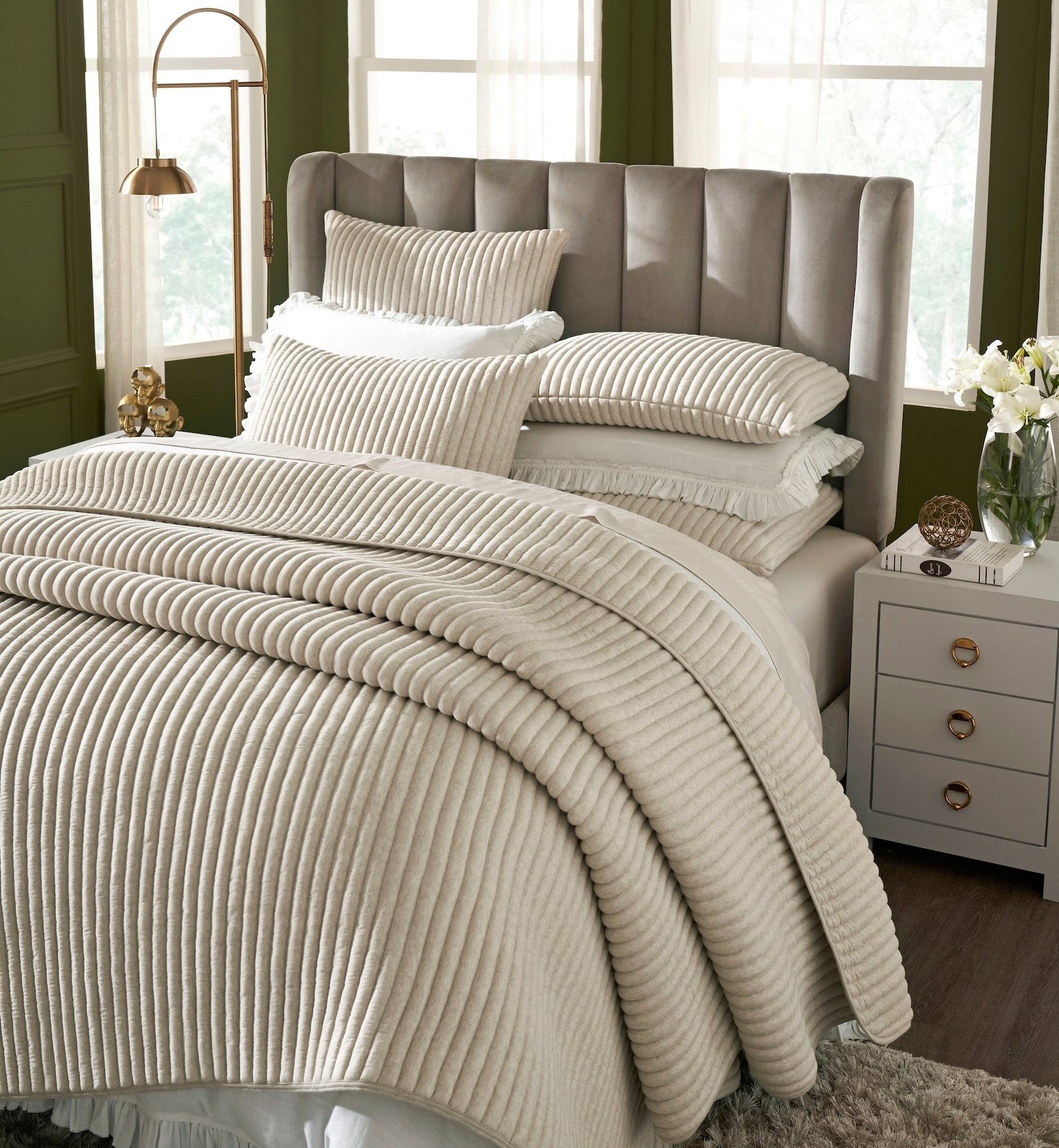 QT-368-11096_3|Close-up of a beige ribbed quilted quilt and pillows, showcasing the soft texture and modern striped design beautifully.