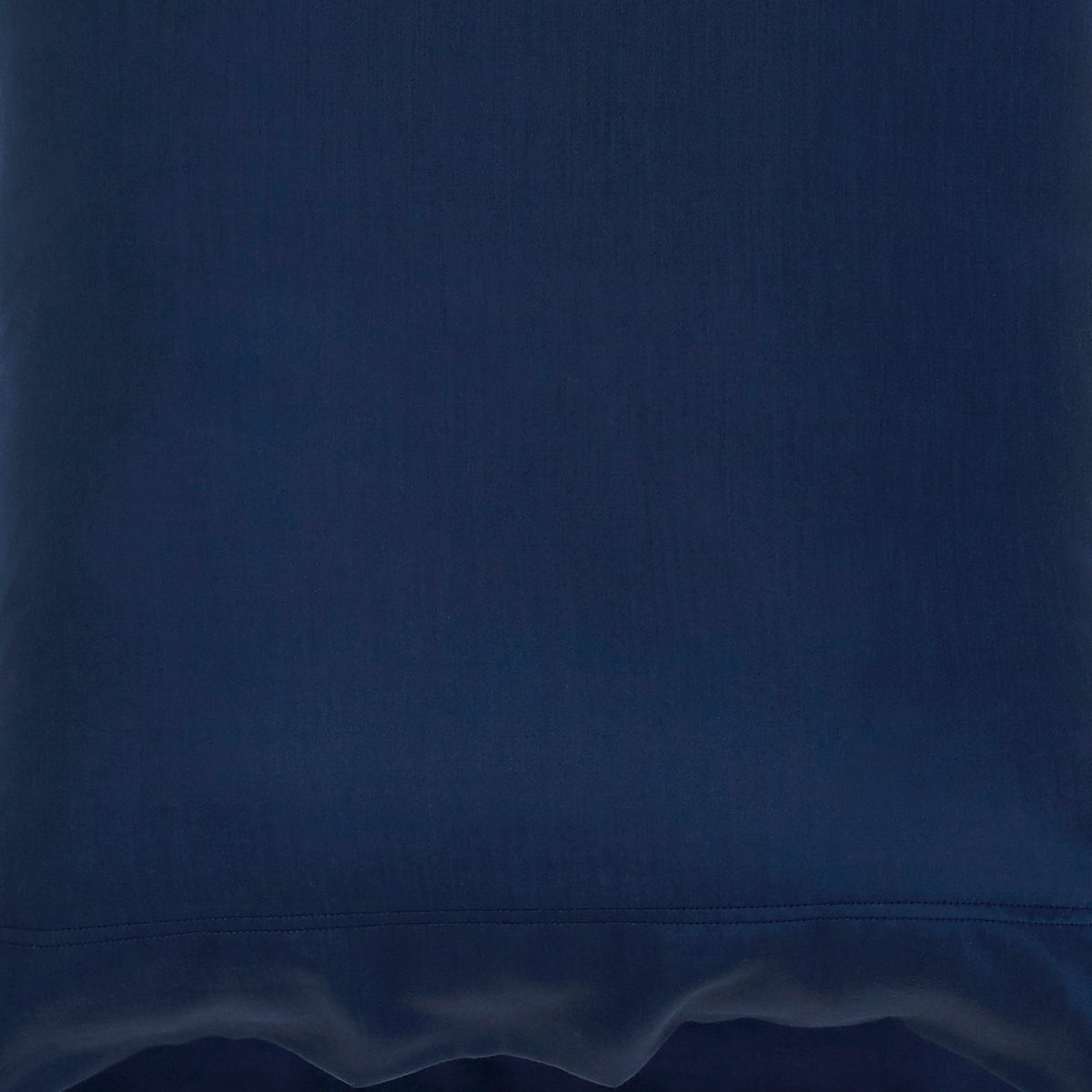 CSS-511-7284_6|Close-up view of a navy 100% Lyocell sheet with a flat weave, revealing fine texture and a subtle stitched hem.