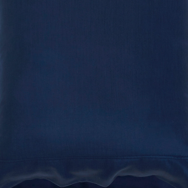 CSS-511-7284_6|Close-up view of a navy 100% Lyocell sheet with a flat weave, revealing fine texture and a subtle stitched hem.