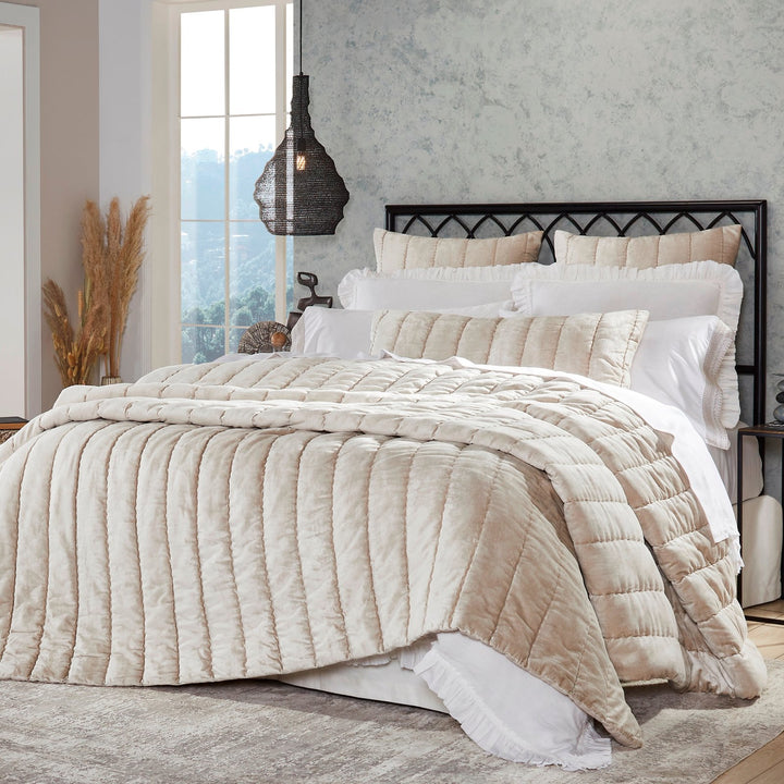 QT-339-9496_2|Elegant champagne velvet channel-quilted quilt draped over a bed in a stylish bedroom setting, soft texture.
