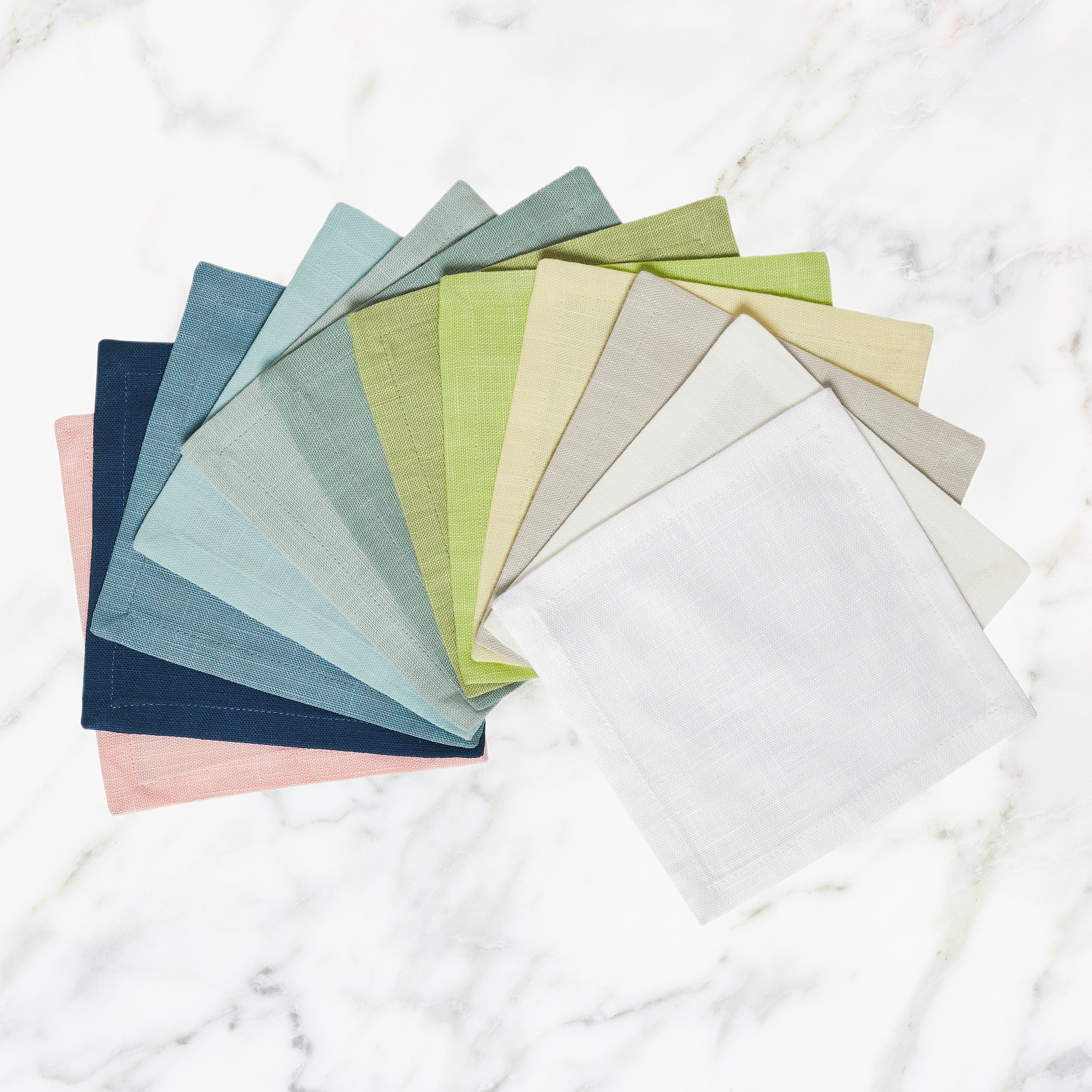 CNP-4901-X_1|Assorted colorful linen dinner napkins in a fan, offering a vibrant mix and match for diverse elegant table settings.