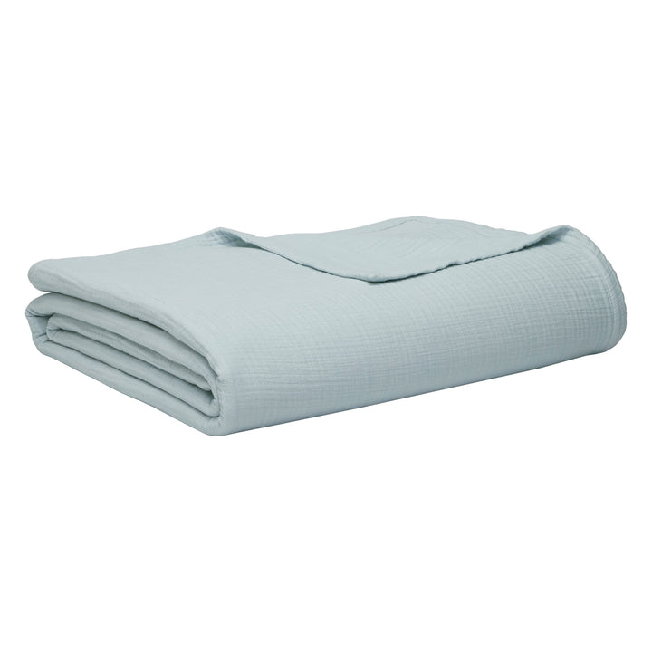 BL-863-11096_7|Folded light blue 100% cotton gauze blanket, soft texture, perfect for cozy comfort and stylish home decor.