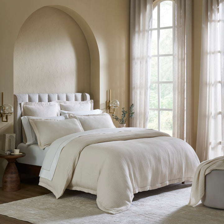 DT-049-10692_2|Neutral cream textured duvet cover on a modern bed, bathed in natural light, creating an inviting and elegant bedroom.