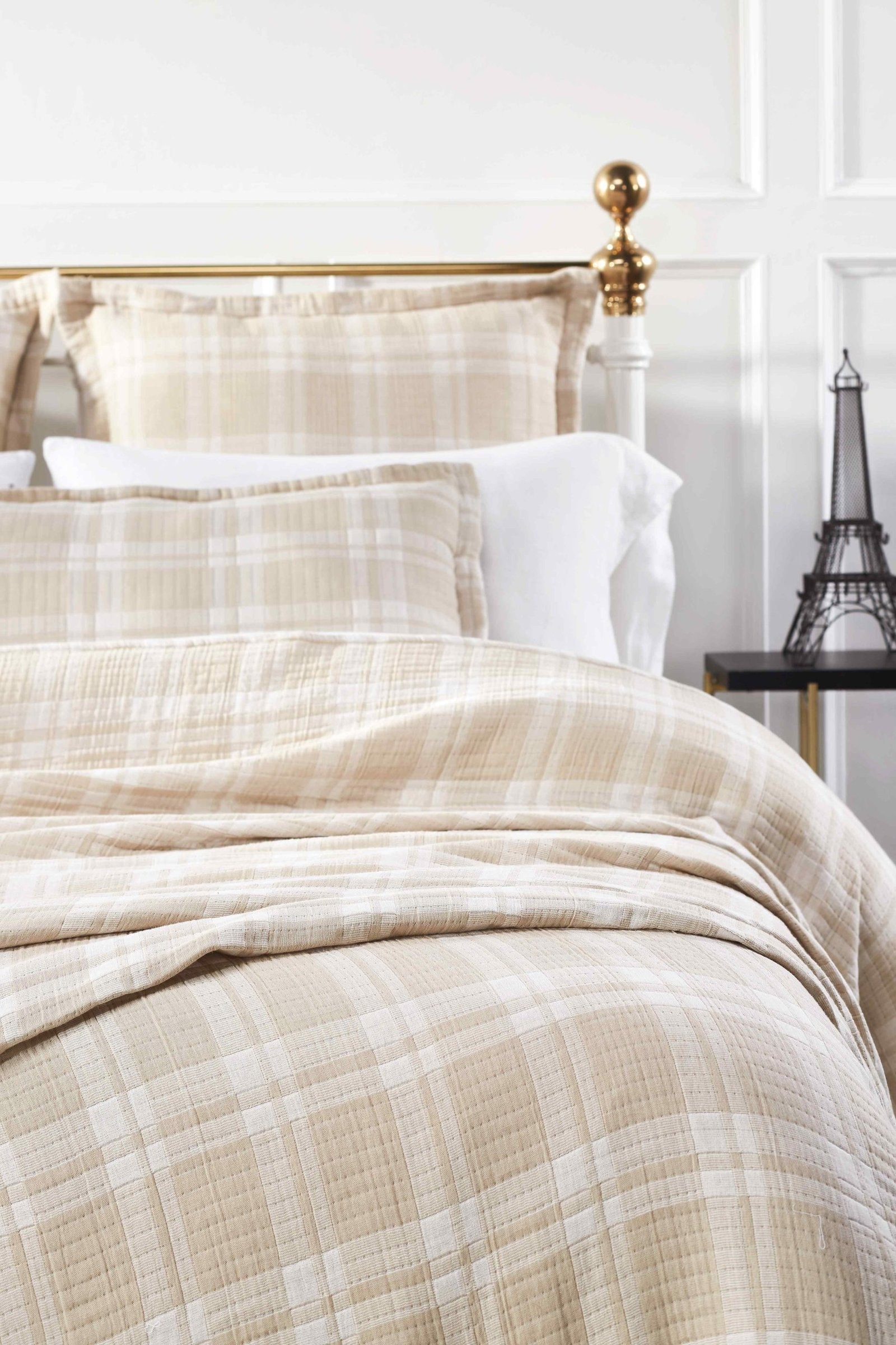 BT-118-11096_1|Soft beige and white plaid patterned cotton quilt blanket draped elegantly over a bed, offering warmth and classic style.