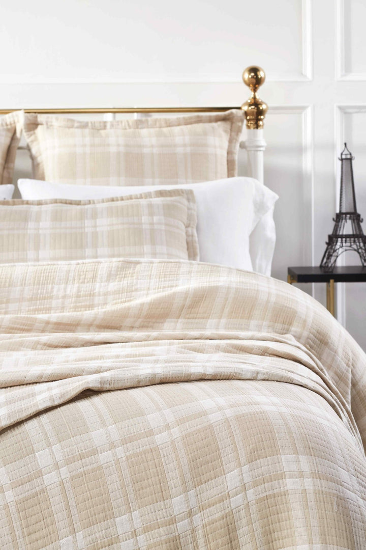 BT-118-11096_1|Soft beige and white plaid patterned cotton quilt blanket draped elegantly over a bed, offering warmth and classic style.