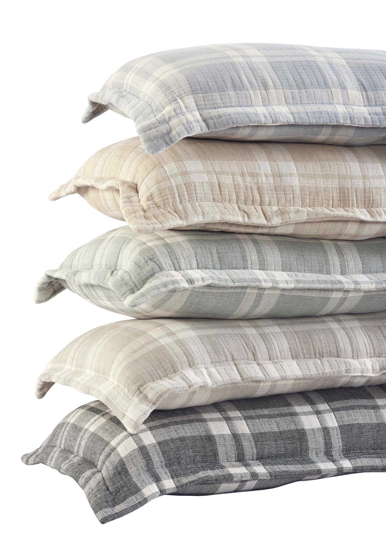 TP-119-1640_3|Stack of five soft plaid decorative pillows in varying shades: blue, beige, green, and grey. Cozy bedding accents.
