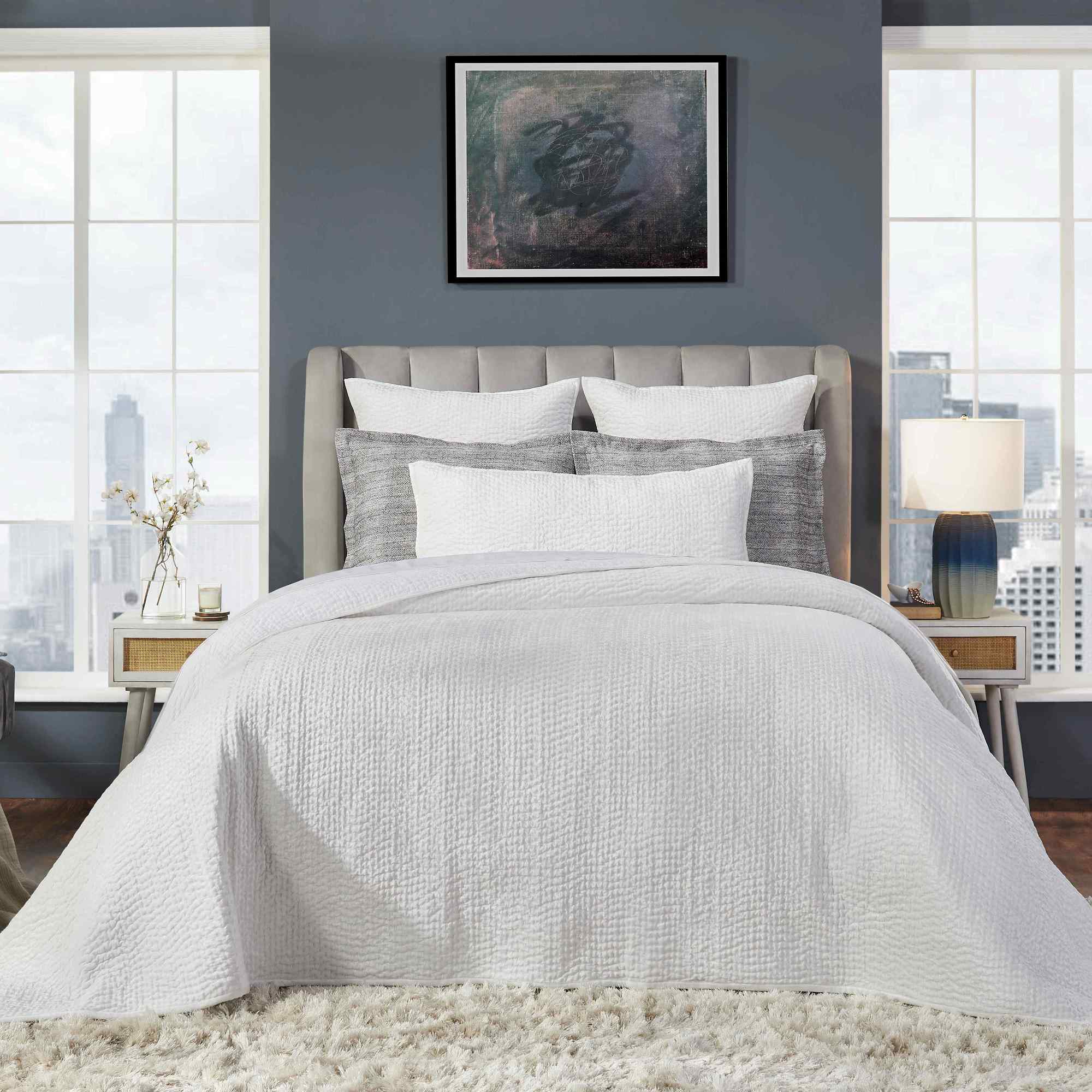 CL-182-11898_3|White textured coverlet on a king bed, elegant quilted bedding for a serene and luxurious sleep space. (119 chars)