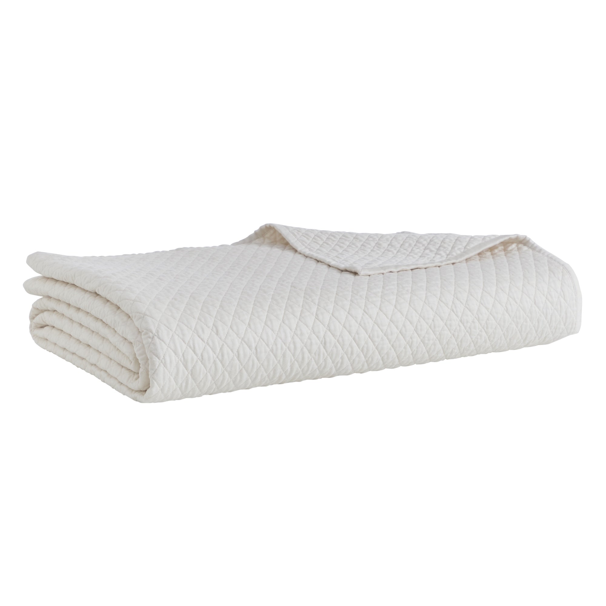 CL-265-9496_5|Neatly folded white diamond quilted coverlet, showcasing its elegant pattern. Premium quality and soft, pristine bedding.