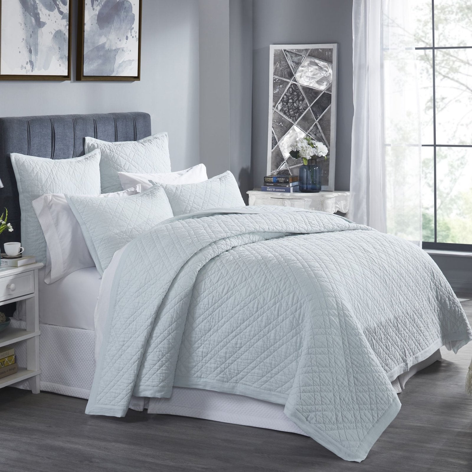 CL-255-9496_2|Serene light blue quilted coverlet dressing a modern bedroom, featuring a subtle diamond pattern for stylish comfort.