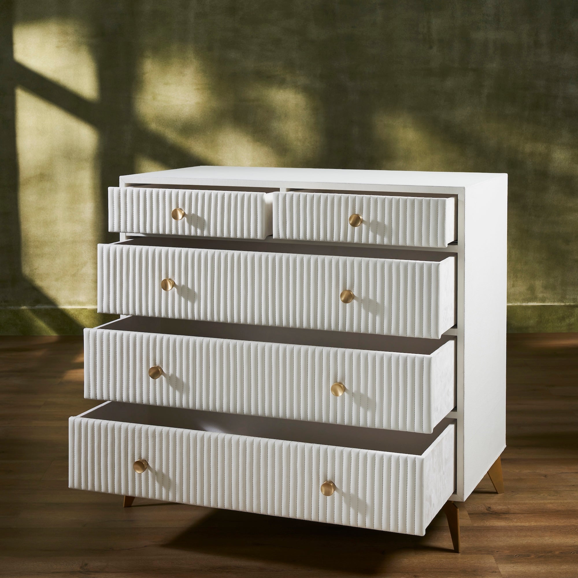 FN-5216-482036_3|Functional white ribbed leather dresser with multiple open drawers, revealing ample and stylish modern bedroom storage.