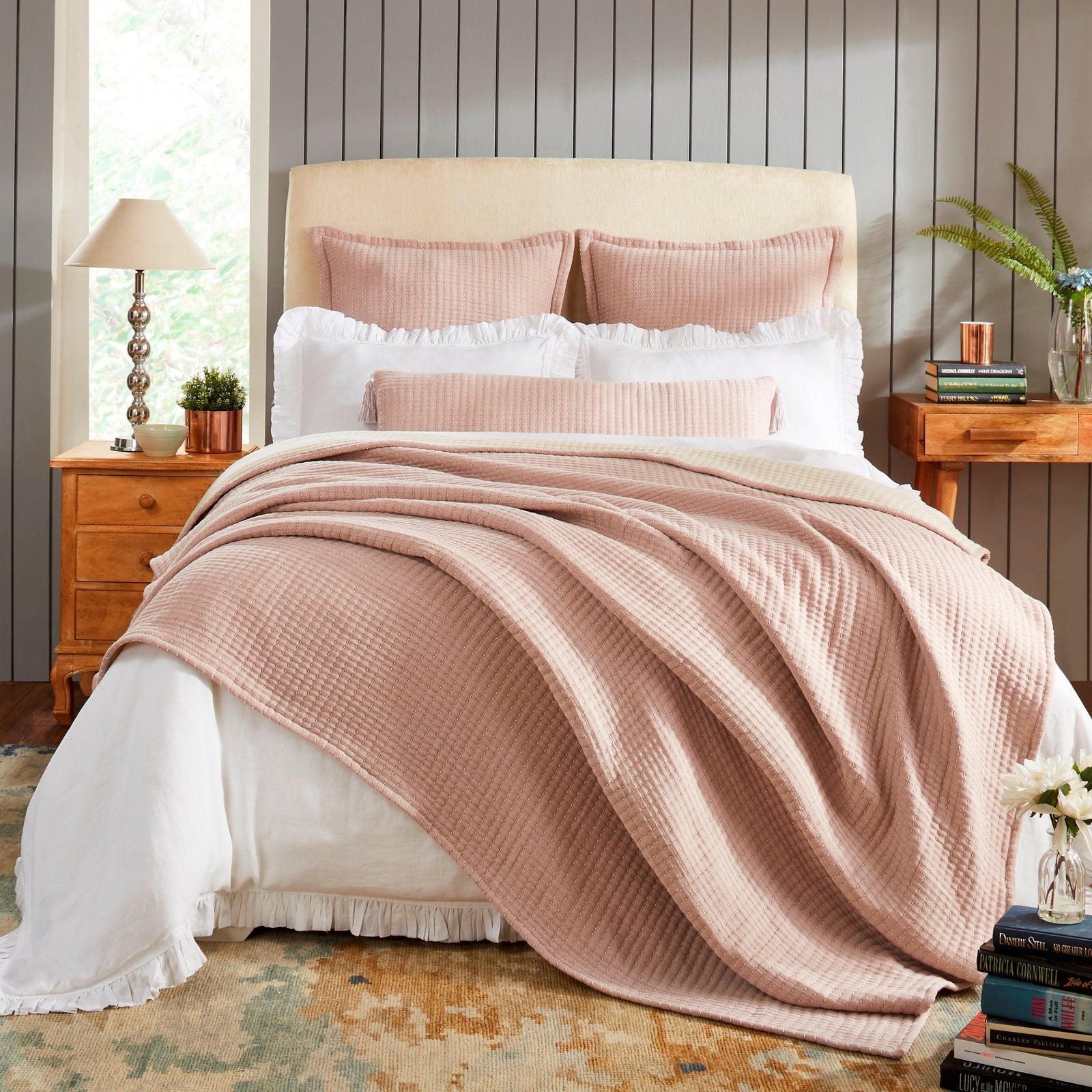 BT-105-X_1|Cozy blush pink waffle weave blanket draped over a bed. Adds warmth and soft texture to bedroom decor.