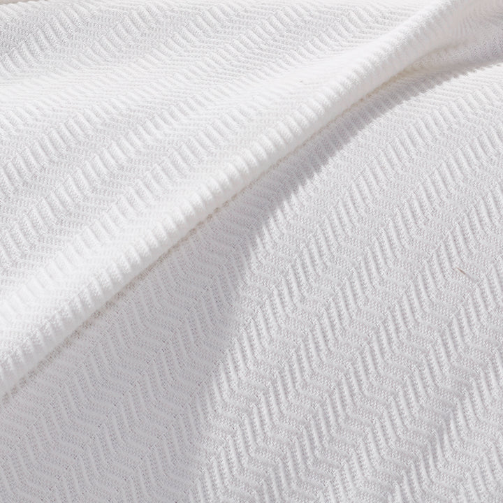 SWT-854-7.8_1|Soft white knit blanket with a subtle wavy chevron texture, perfect for cozying up or adding elegance to any room.