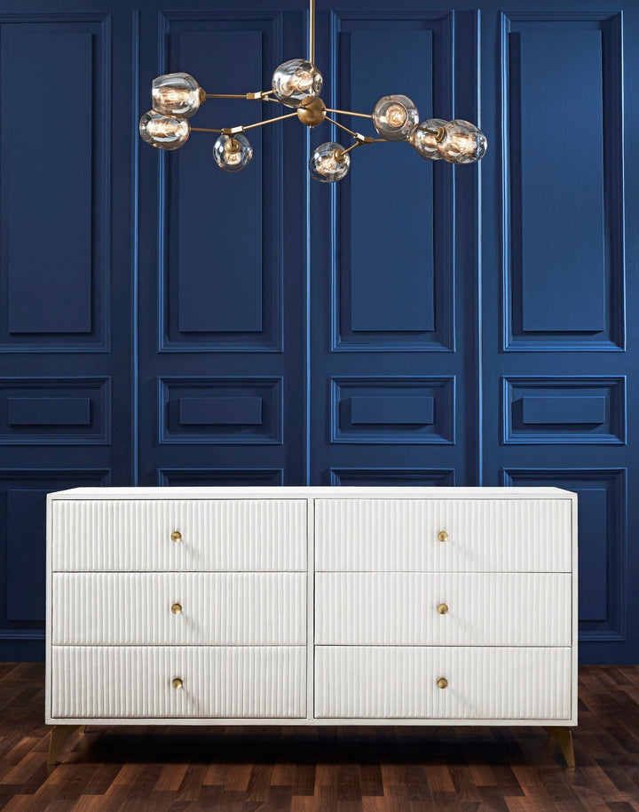 FN-5203-642033_2|Contemporary white six-drawer dresser with unique ribbed detailing and elegant brass knob pulls, perfect for any room.