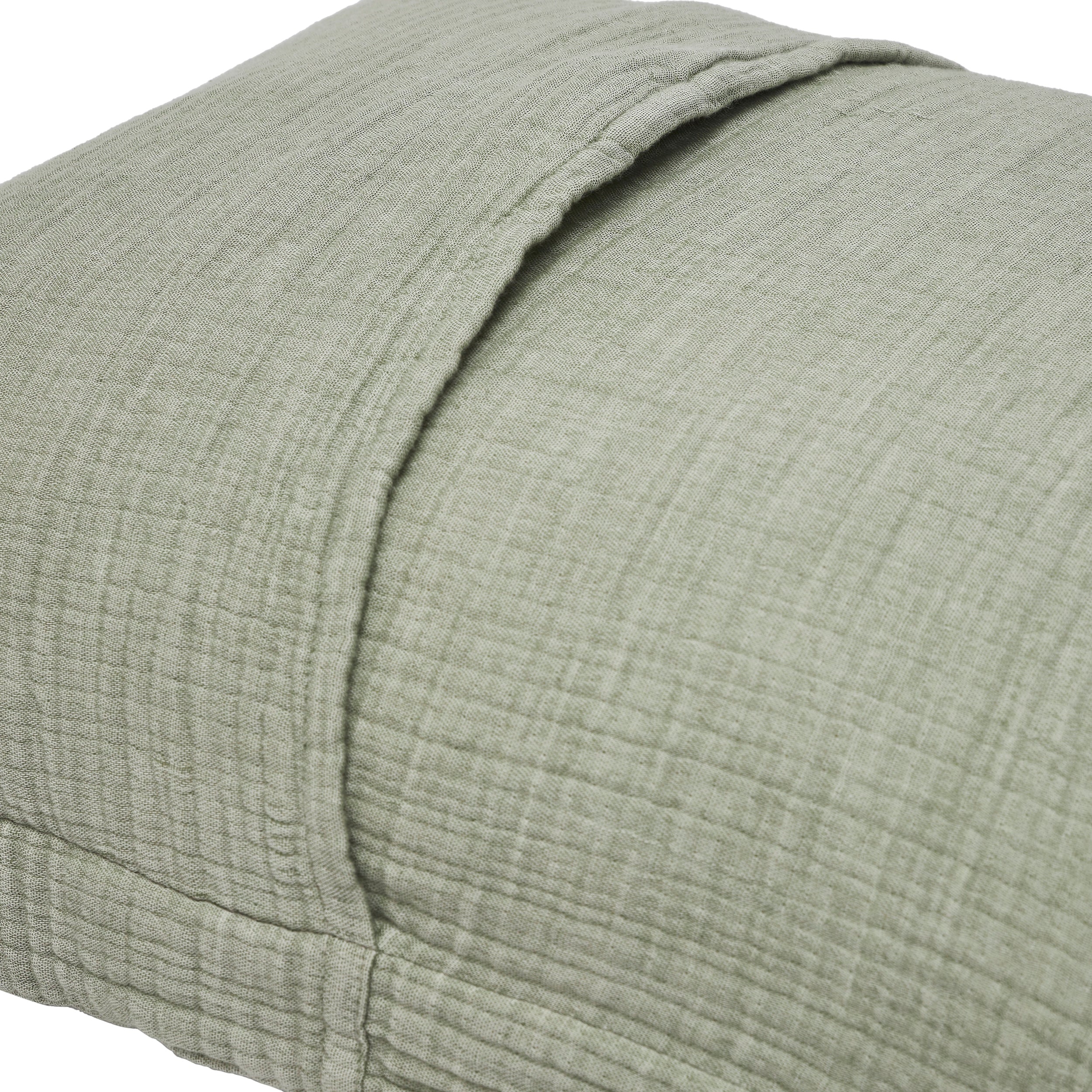 ES-051-2626_2|Close-up of sage green textured cotton pillow sham showing envelope closure, part of a soft and inviting duvet cover aesthetic.