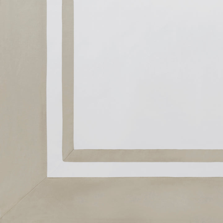 ASP-540-2032_5|Detailed view of a white 100% cotton sateen flat sheet, featuring a crisp, wide solid beige border with mitered corner.