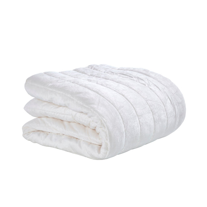 QT-337-9496_4|Folded white textured quilt featuring elegant vertical channel quilting. Soft, clean design for contemporary bedrooms.