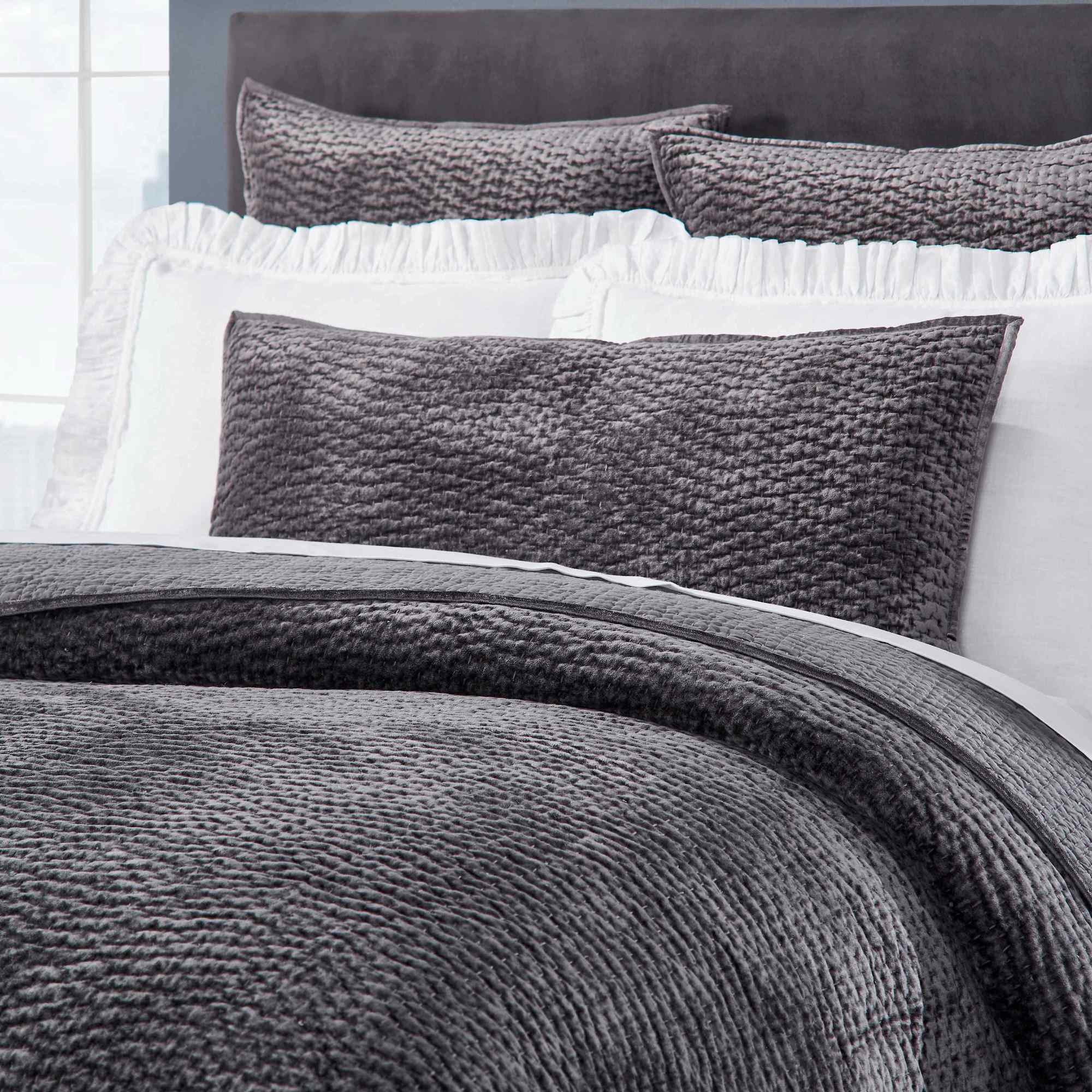 CL-184-9496_3|Detailed view of a dark gray textured coverlet and matching plush pillows, highlighting their soft, inviting texture.
